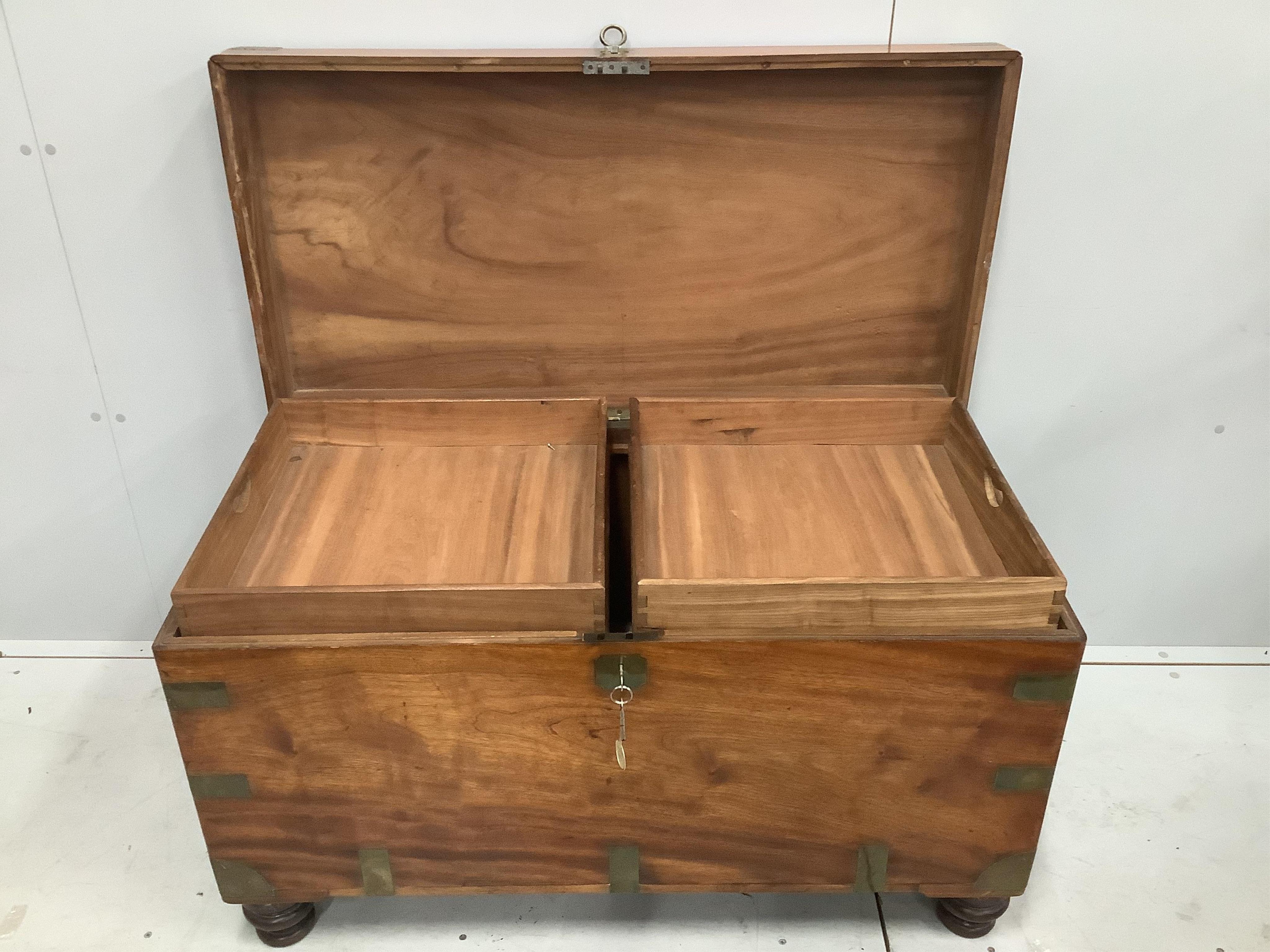 A 19th century camphorwood and brass bound campaign chest, with internal trays, on turned feet, width 106cm, height 64cm. Condition - good